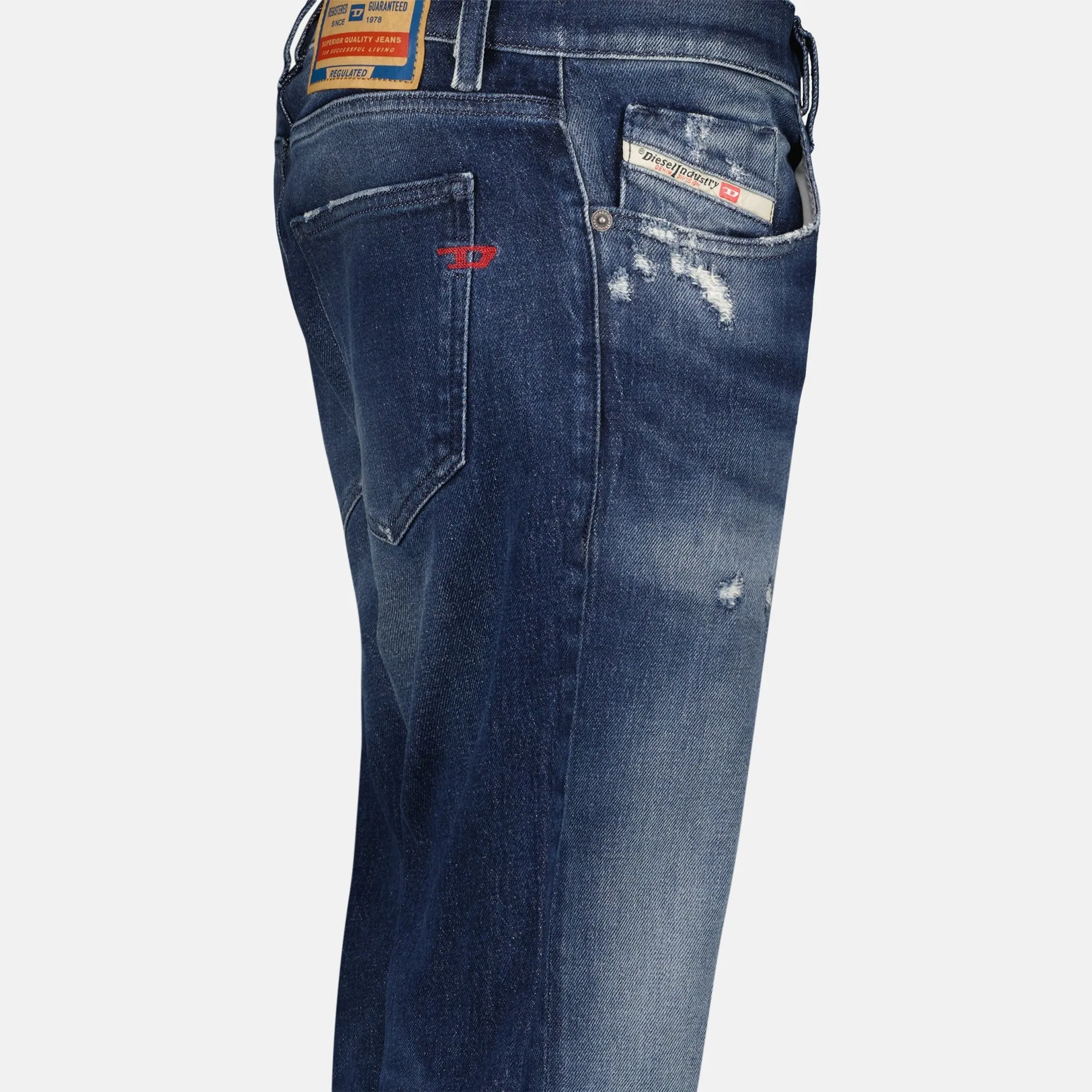 Slim-fit distressed denim jeans